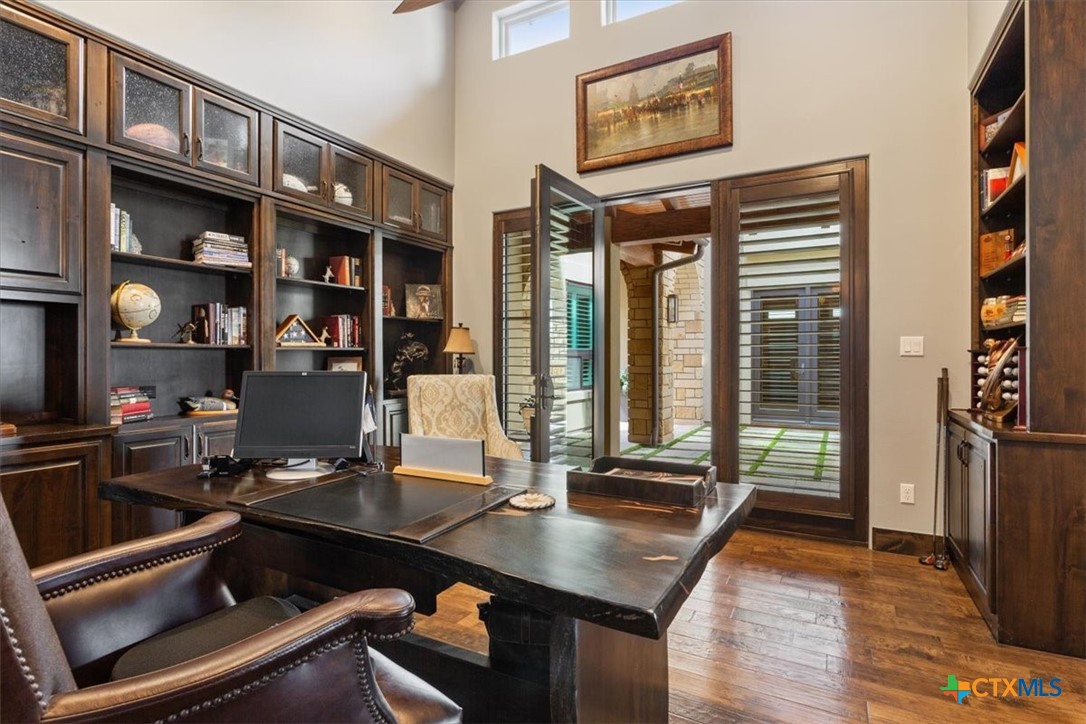 3319 Eagle Ridge Drive Harker Heights, TX 76548 - Photo 18 of 48 a room with wooden floor and large windows