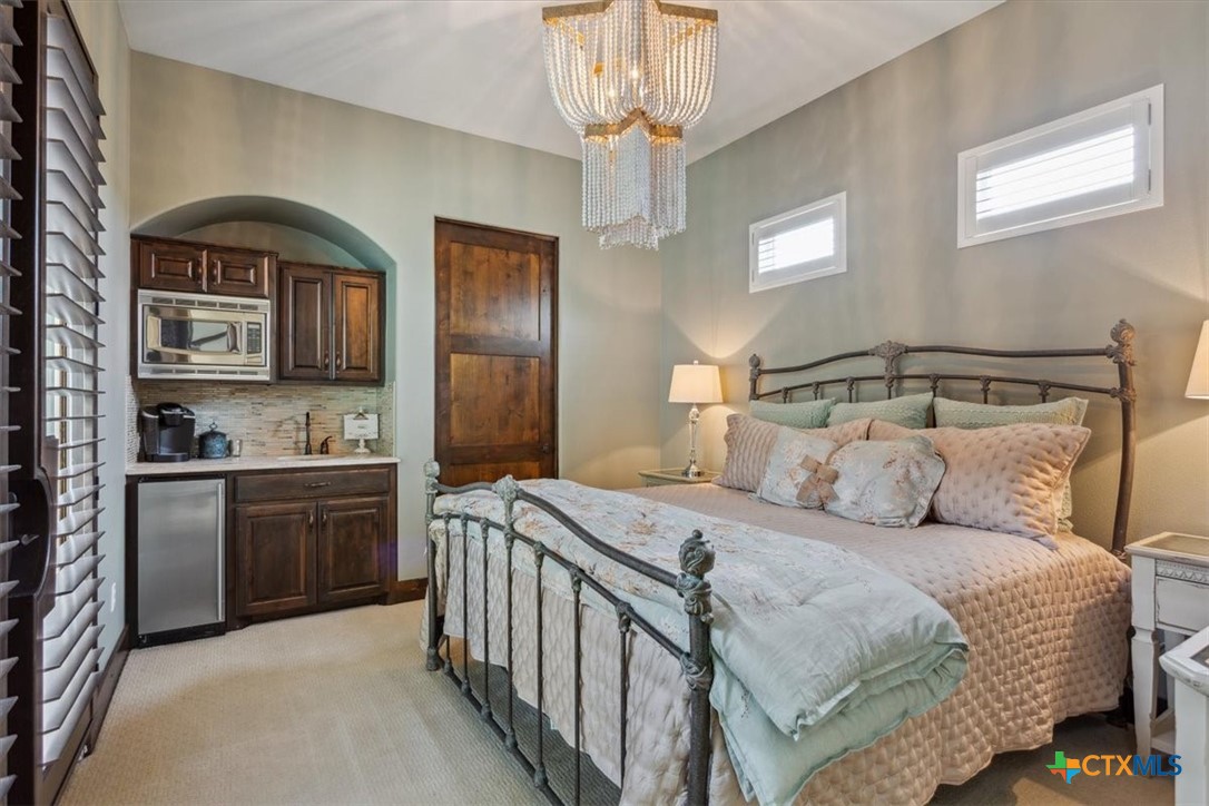 3319 Eagle Ridge Drive Harker Heights, TX 76548 - Photo 29 of 48 a bedroom with a large bed and a sink