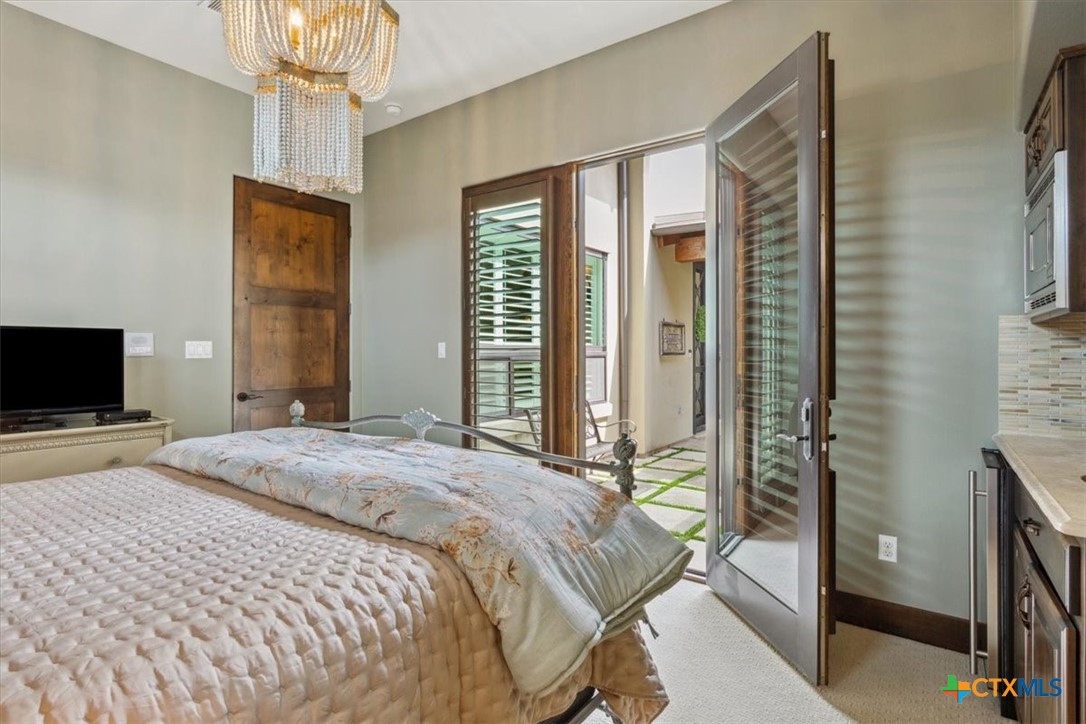 3319 Eagle Ridge Drive Harker Heights, TX 76548 - Photo 30 of 48 a bedroom with a bed and a flat screen tv