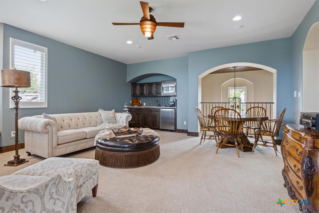3319 Eagle Ridge Drive Harker Heights, TX 76548 - Photo 32 of 48 a living room with furniture a rug and a chandelier
