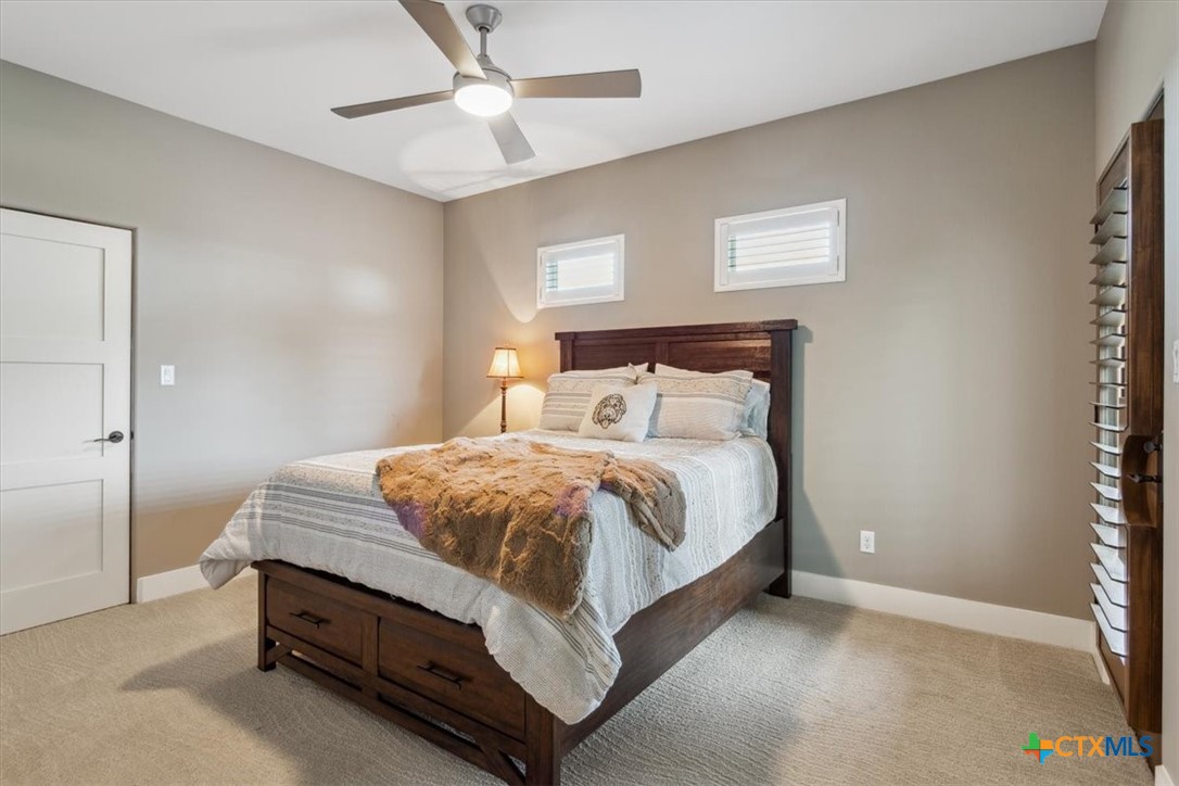 3319 Eagle Ridge Drive Harker Heights, TX 76548 - Photo 35 of 48 a spacious bedroom with a bed and a chandelier
