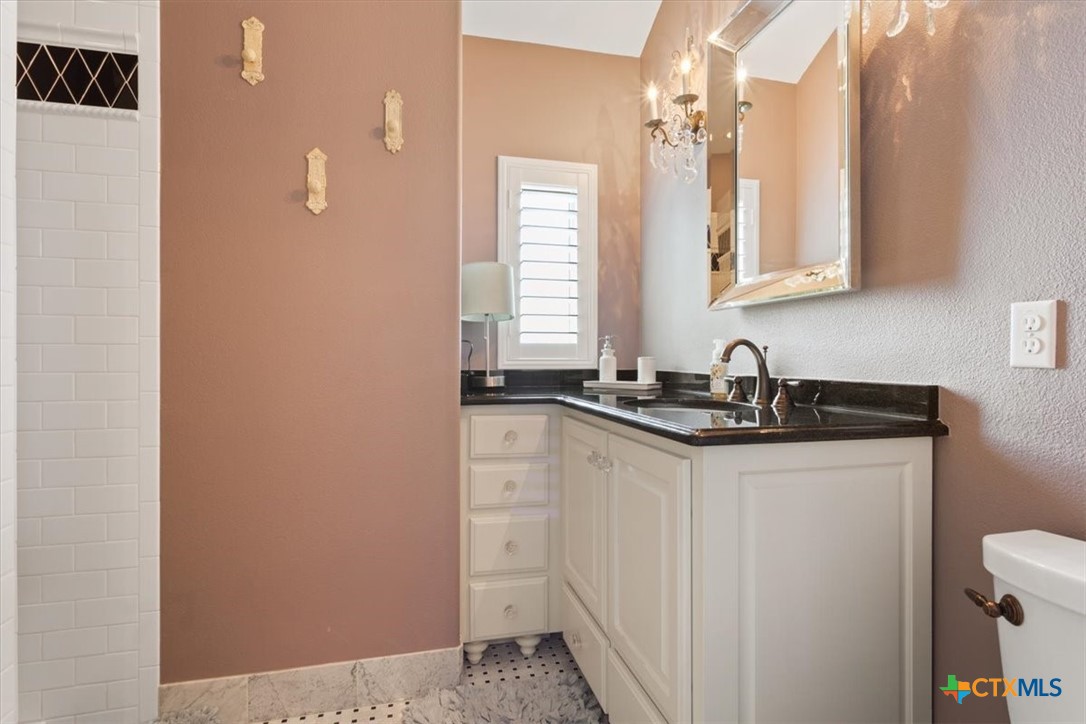 3319 Eagle Ridge Drive Harker Heights, TX 76548 - Photo 38 of 48 a bathroom with a sink and a mirror