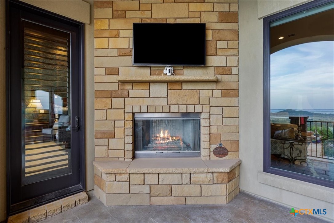 3319 Eagle Ridge Drive Harker Heights, TX 76548 - Photo 40 of 48 a living room with a fireplace a flat screen tv and a fireplace