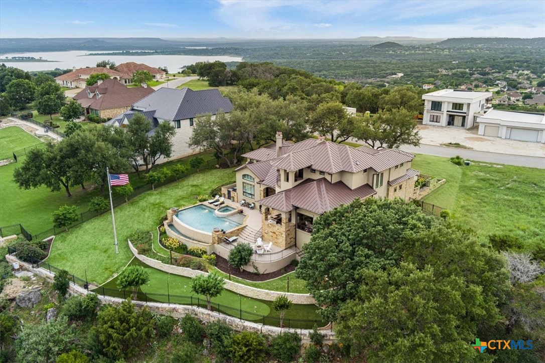 3319 Eagle Ridge Drive Harker Heights, TX 76548 - Photo 46 of 48 an aerial view of a house with a garden and lake view