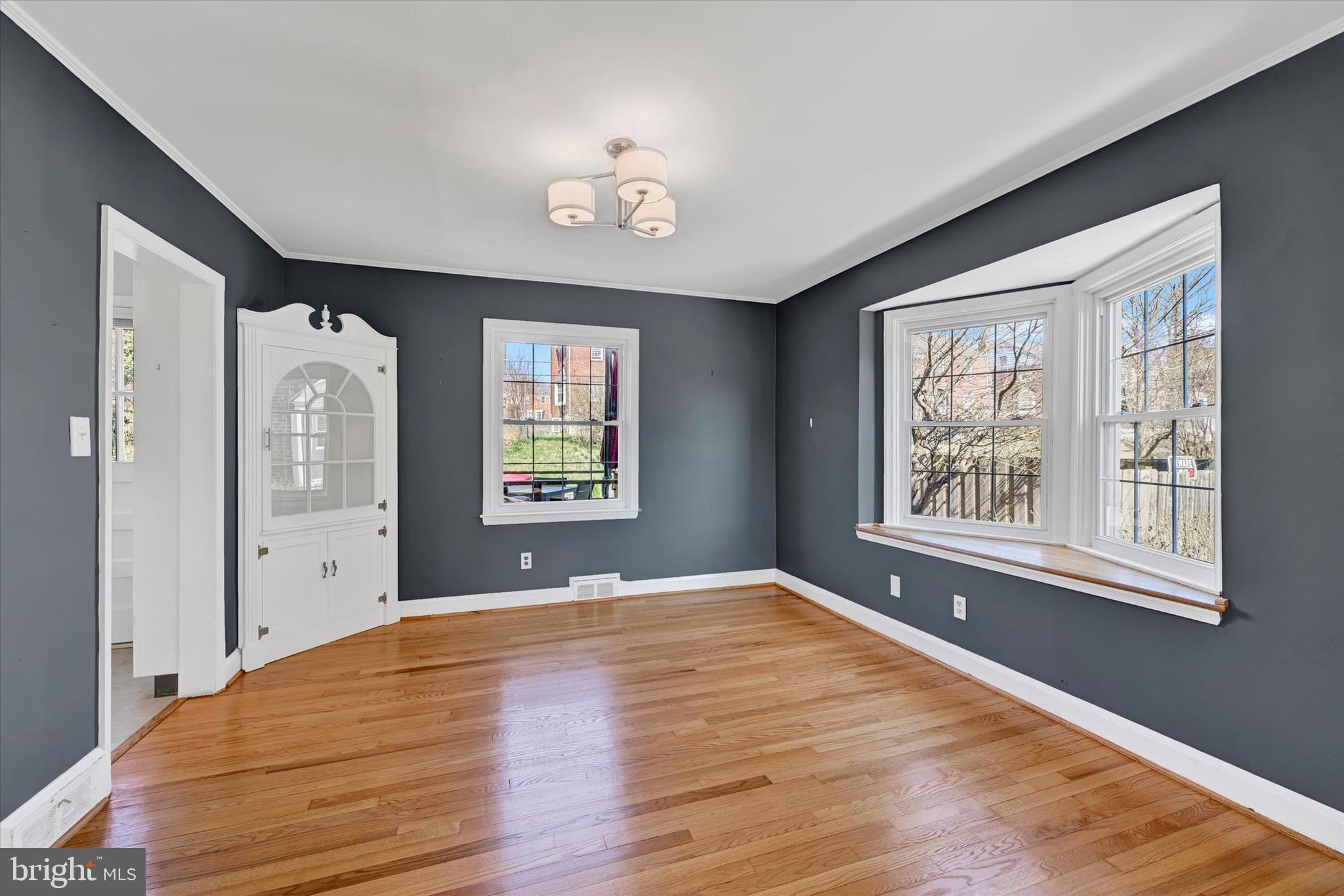 8122 Glen Gary Road Towson, MD 21286 - Photo 11 of 48 a view of an empty room with a window and wooden floor