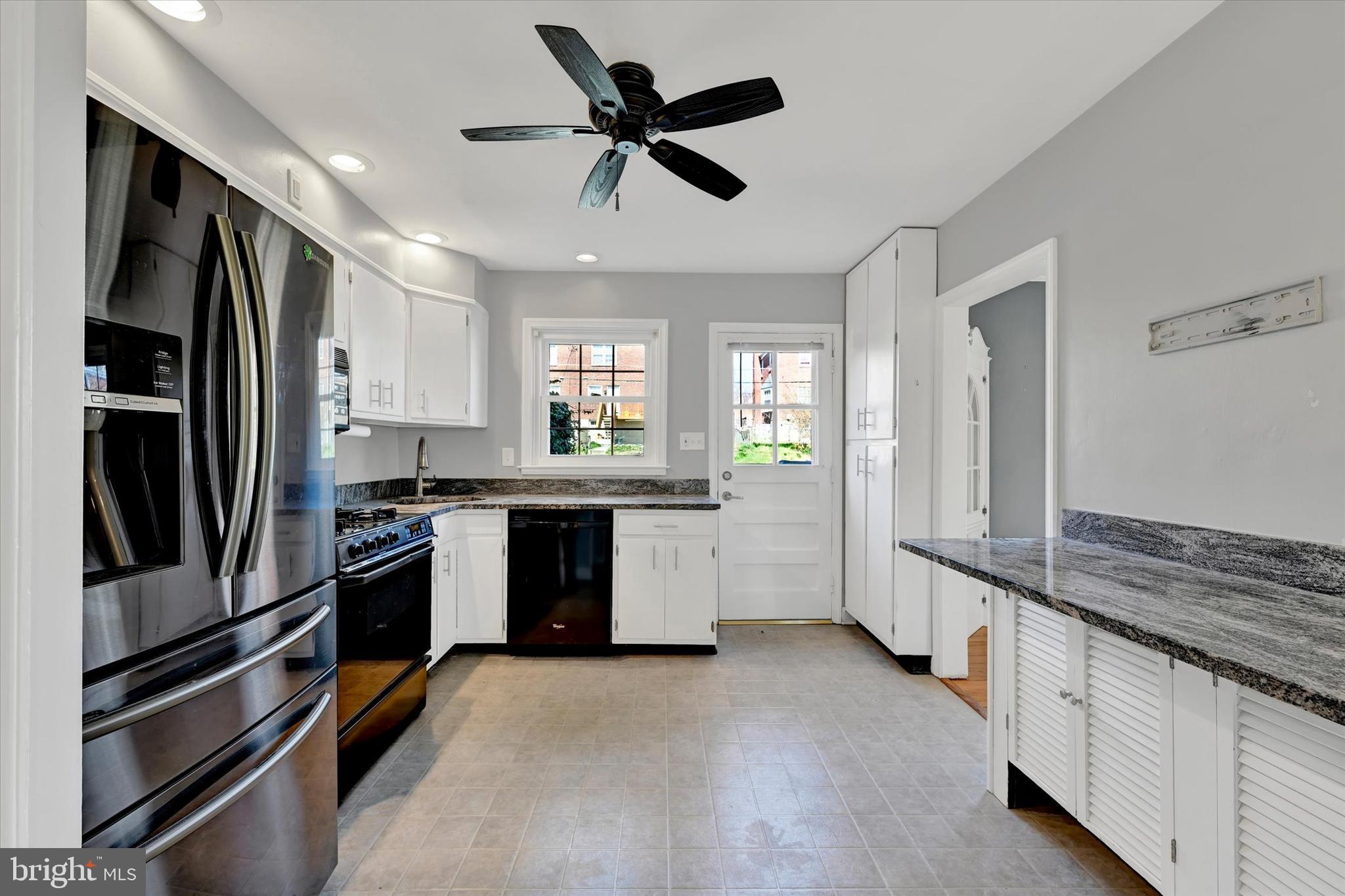 8122 Glen Gary Road Towson, MD 21286 - Photo 15 of 48 a kitchen with stainless steel appliances granite countertop a refrigerator a stove and a sink