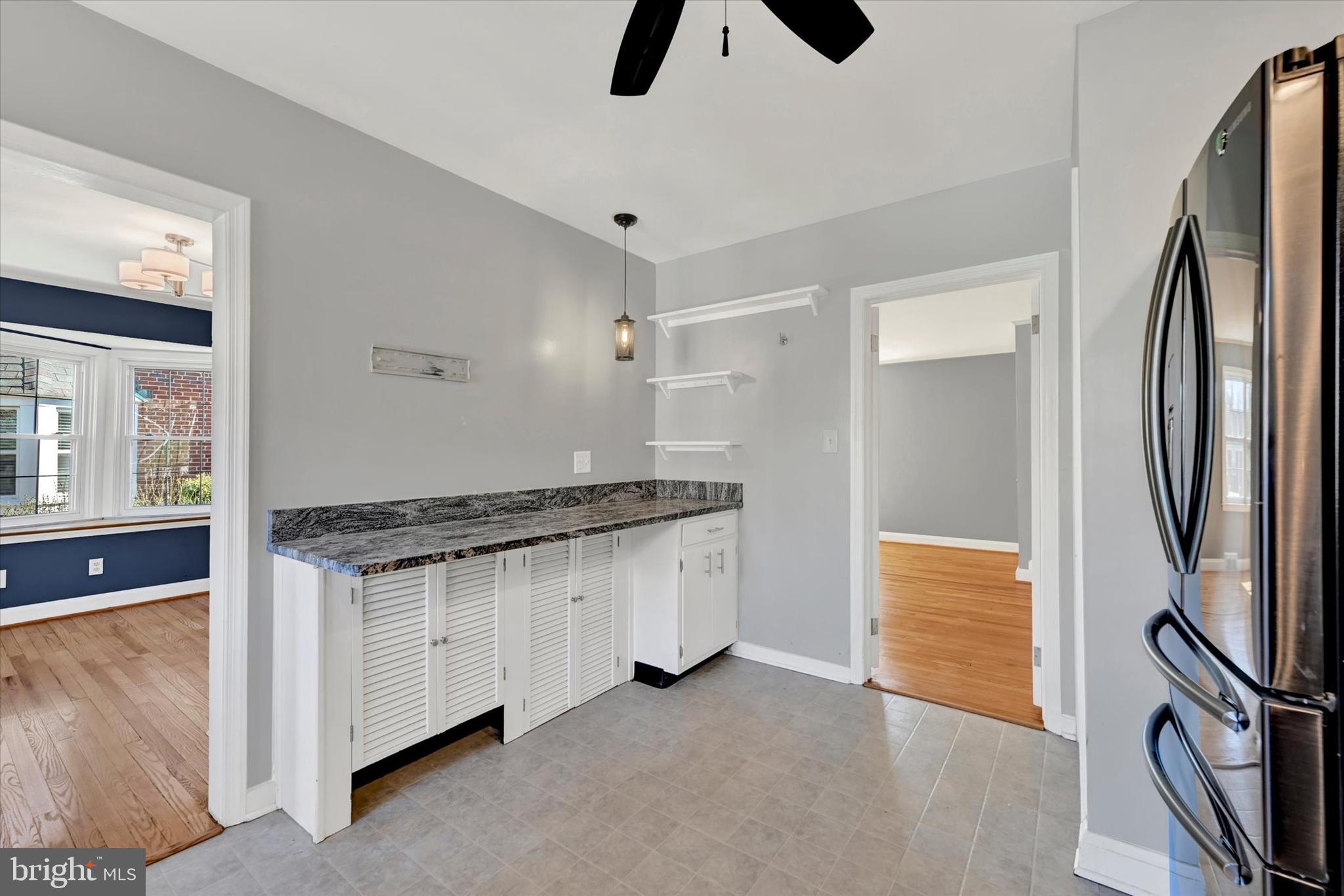 8122 Glen Gary Road Towson, MD 21286 - Photo 18 of 48 a kitchen with granite countertop a stove and a refrigerator