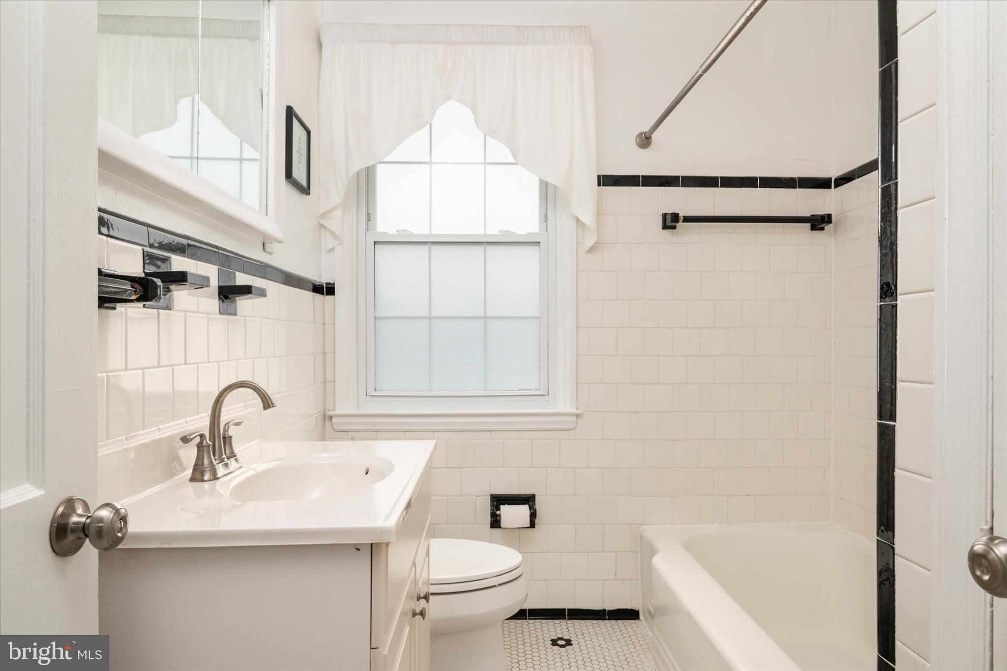 8122 Glen Gary Road Towson, MD 21286 - Photo 21 of 48 a bathroom with a sink toilet and shower