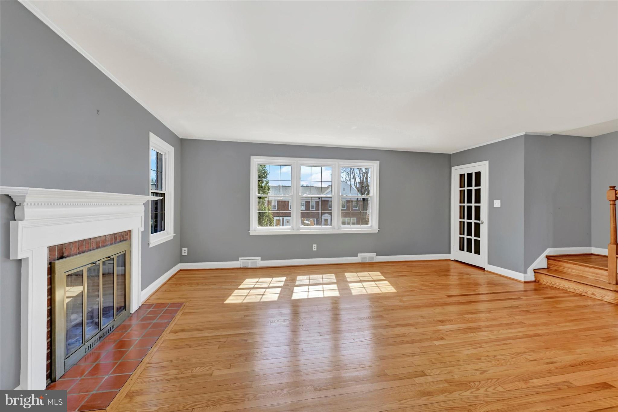 8122 Glen Gary Road Towson, MD 21286 - Photo 5 of 48 a view of an empty room with a window and fireplace