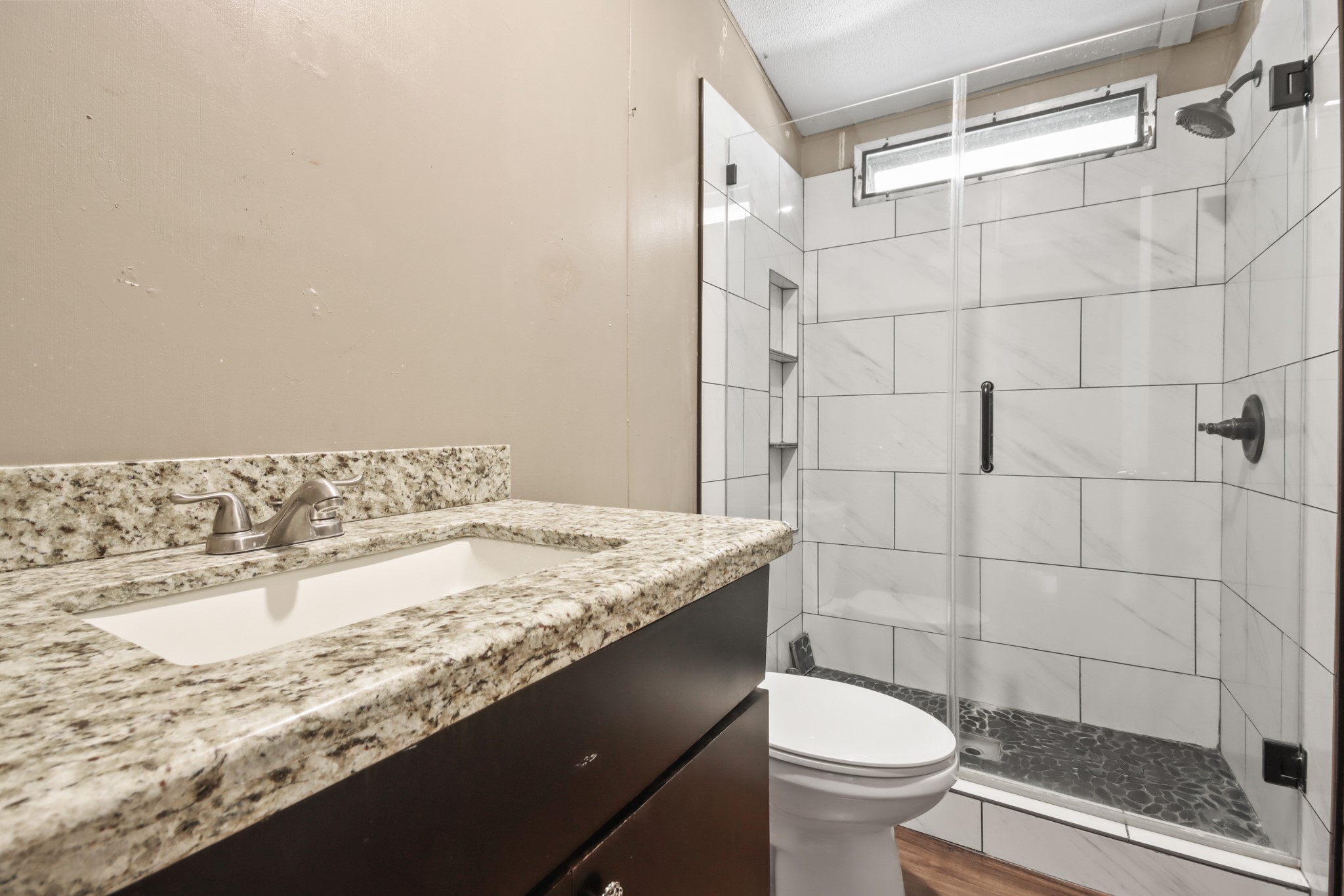 17317 East Greenleaf Lane Conroe, TX 77306 - Photo 14 of 24 a bathroom with a granite countertop sink toilet and shower
