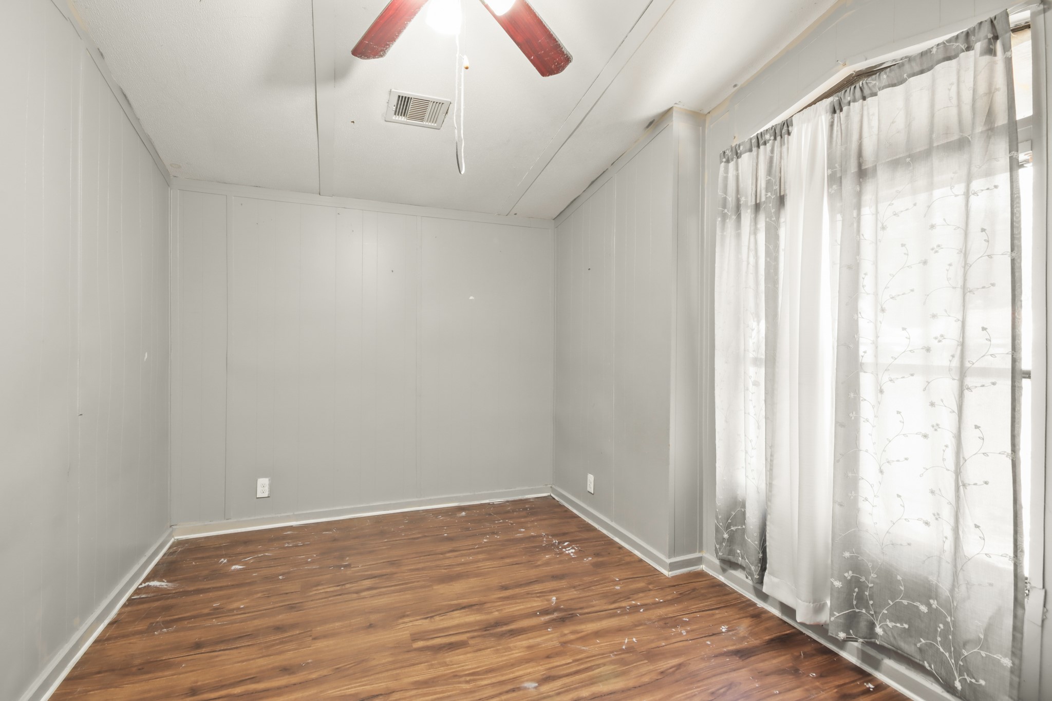 17317 East Greenleaf Lane Conroe, TX 77306 - Photo 15 of 24 a view of an empty room with wooden floor