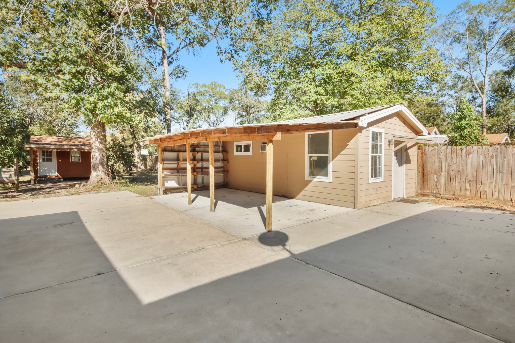 17317 East Greenleaf Lane Conroe, TX 77306 - Photo 24 of 24 a patio with table and chairs
