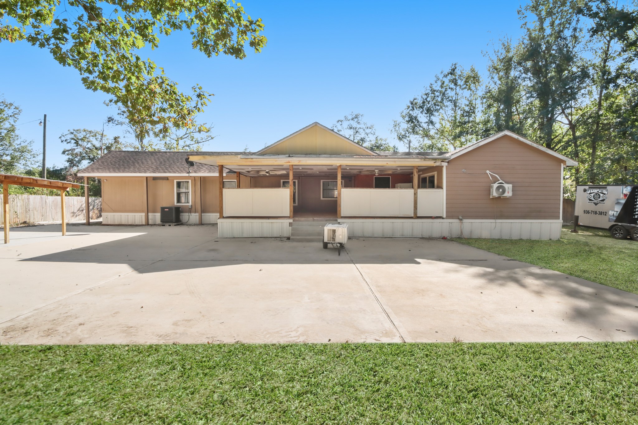 17317 East Greenleaf Lane Conroe, TX 77306 - Photo 5 of 24 a front view of a house with a yard and garage
