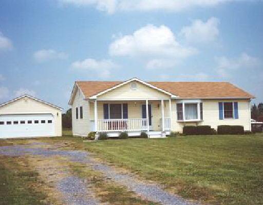3021 Morgans Mill Road Goodview, VA 24095 - Photo 1 of 1 a front view of a house with garden
