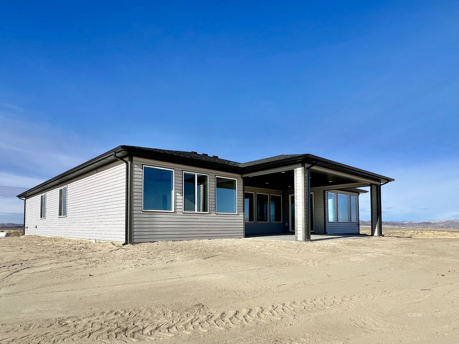 1597 Sun Vly Road, Unit C7 Spring Creek, NV 89815 - Photo 41 of 43 a front view of a house with a yard