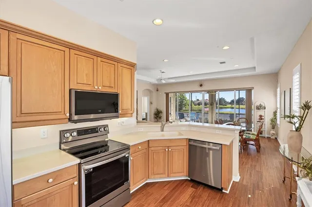 a bathroom with a sink vanity granite toilet and a mirror
