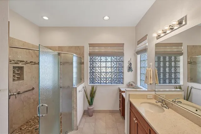 a view of a dining room with furniture a chandelier and window