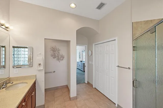 a view of a dinning tables and chairs in the patio in front of a house