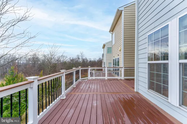 a view of a wooden deck and a yard