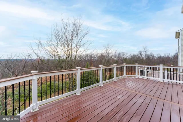 a view of kitchen with furniture and refrigerator