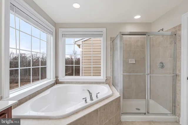 an empty room with chandelier fan