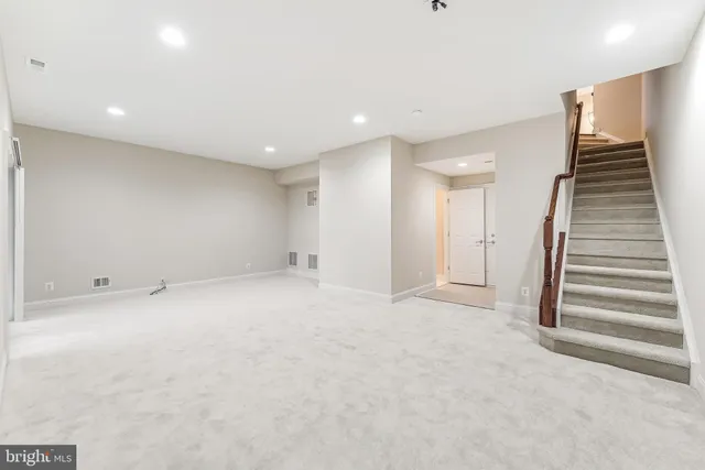 a aerial view of a house with swimming pool and sitting area