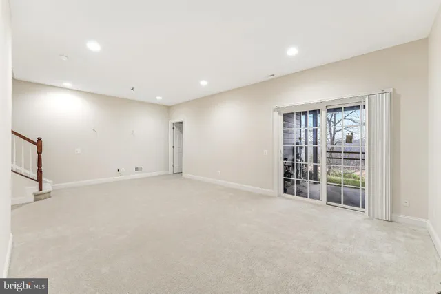 a view of a lake with a table and chairs