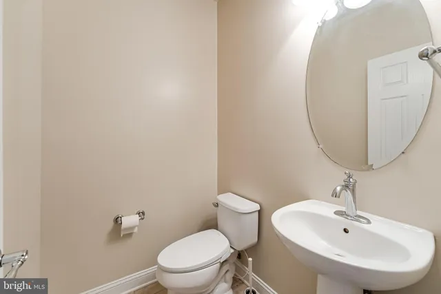 a view of a kitchen with stainless steel appliances granite countertop a stove and a refrigerator