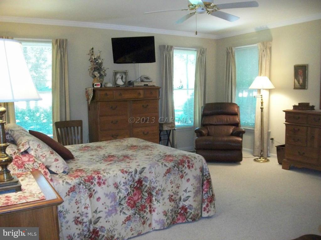 273 Windjammer Road Ocean Pines, MD 21811 - Photo 13 of 33 a bedroom with a bed and a flat screen tv