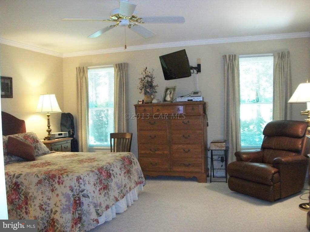 273 Windjammer Road Ocean Pines, MD 21811 - Photo 14 of 33 a bedroom with a bed and furniture