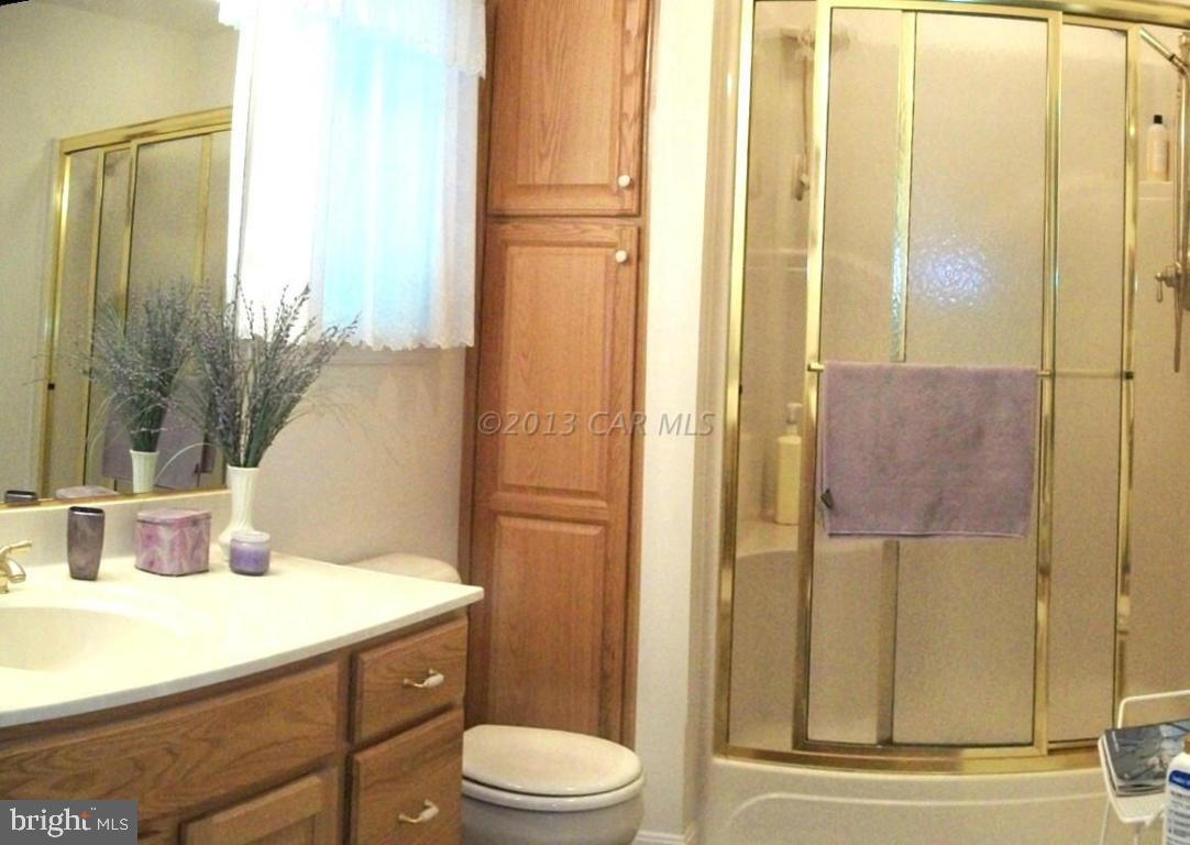 273 Windjammer Road Ocean Pines, MD 21811 - Photo 15 of 33 a bathroom with a sink a toilet and shower