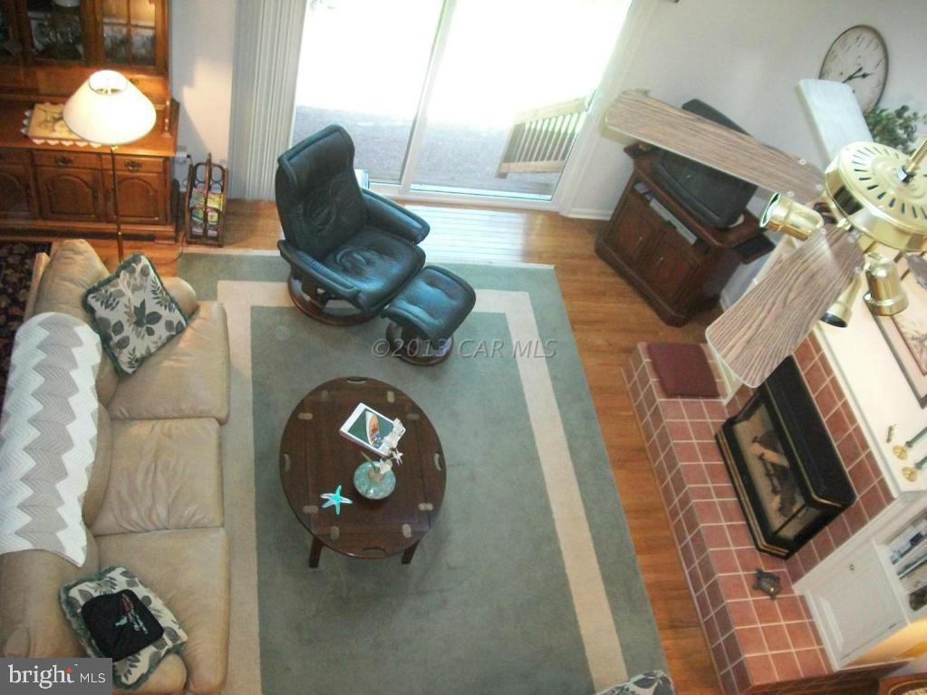 273 Windjammer Road Ocean Pines, MD 21811 - Photo 22 of 33 a living room with furniture and a fireplace
