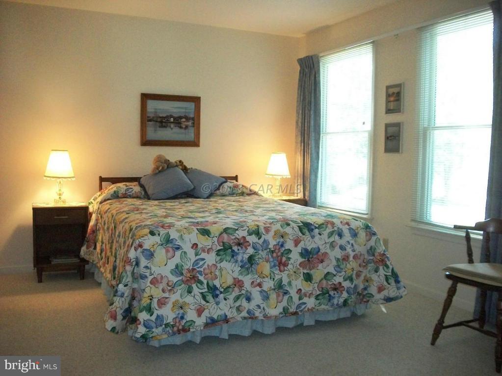 273 Windjammer Road Ocean Pines, MD 21811 - Photo 23 of 33 a bedroom with a bed and chair