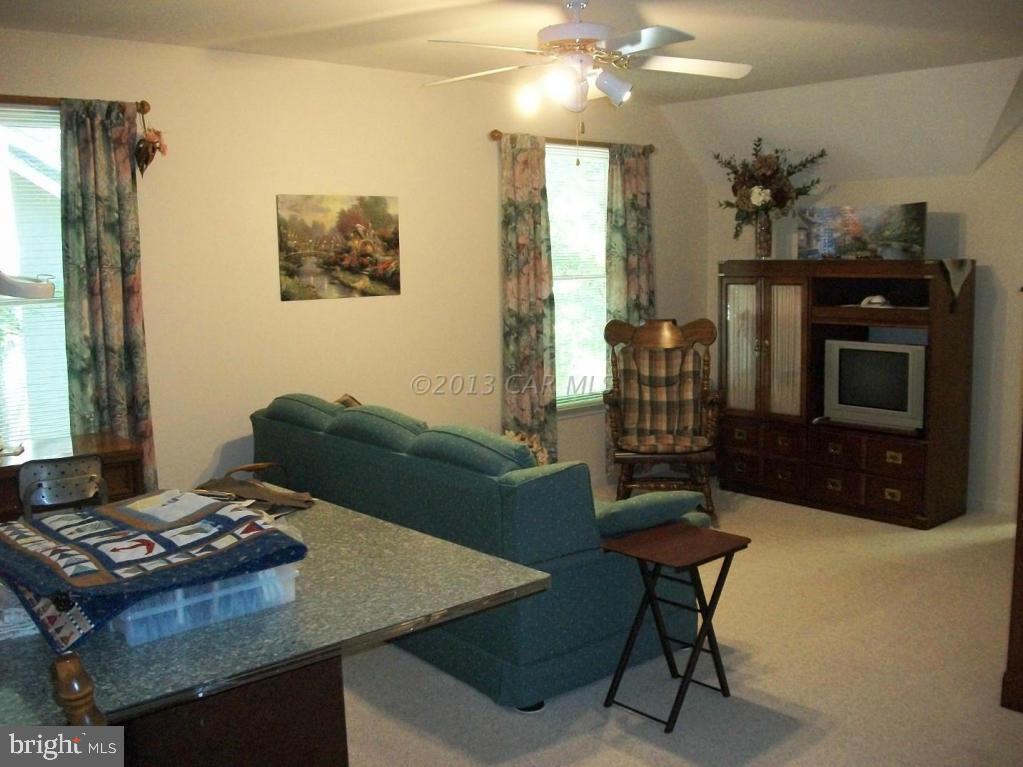 273 Windjammer Road Ocean Pines, MD 21811 - Photo 24 of 33 a living room with furniture and a fireplace