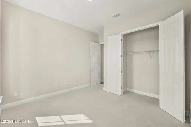 a kitchen with kitchen island a sink stove and cabinets