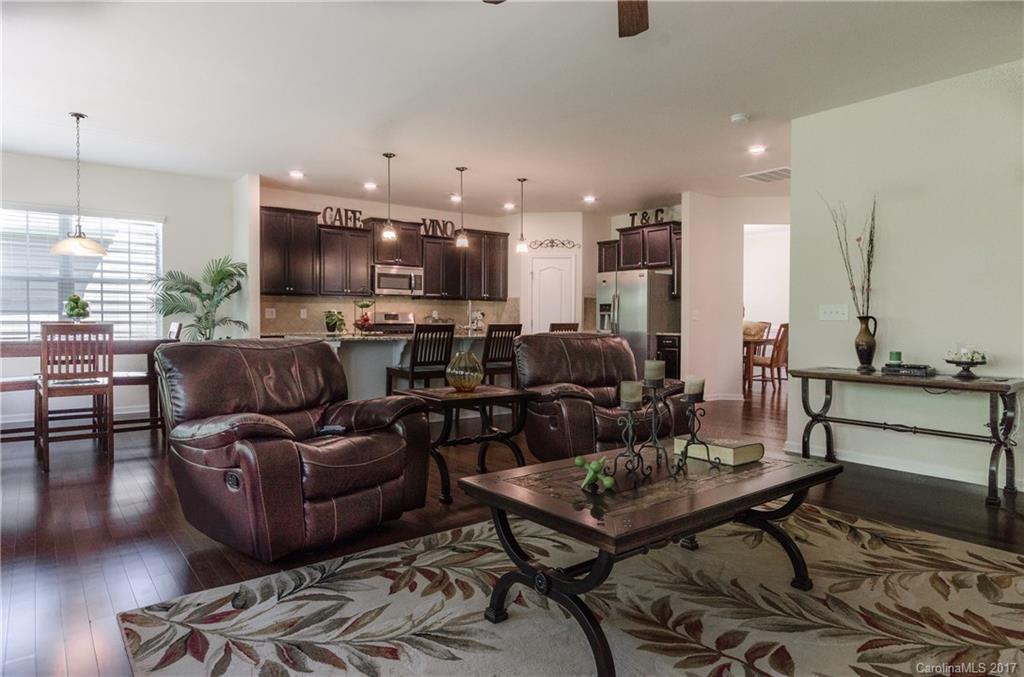 4155 Perth Road Indian Land, SC 29707 - Photo 10 of 24 a living room with furniture a flat screen tv and kitchen view