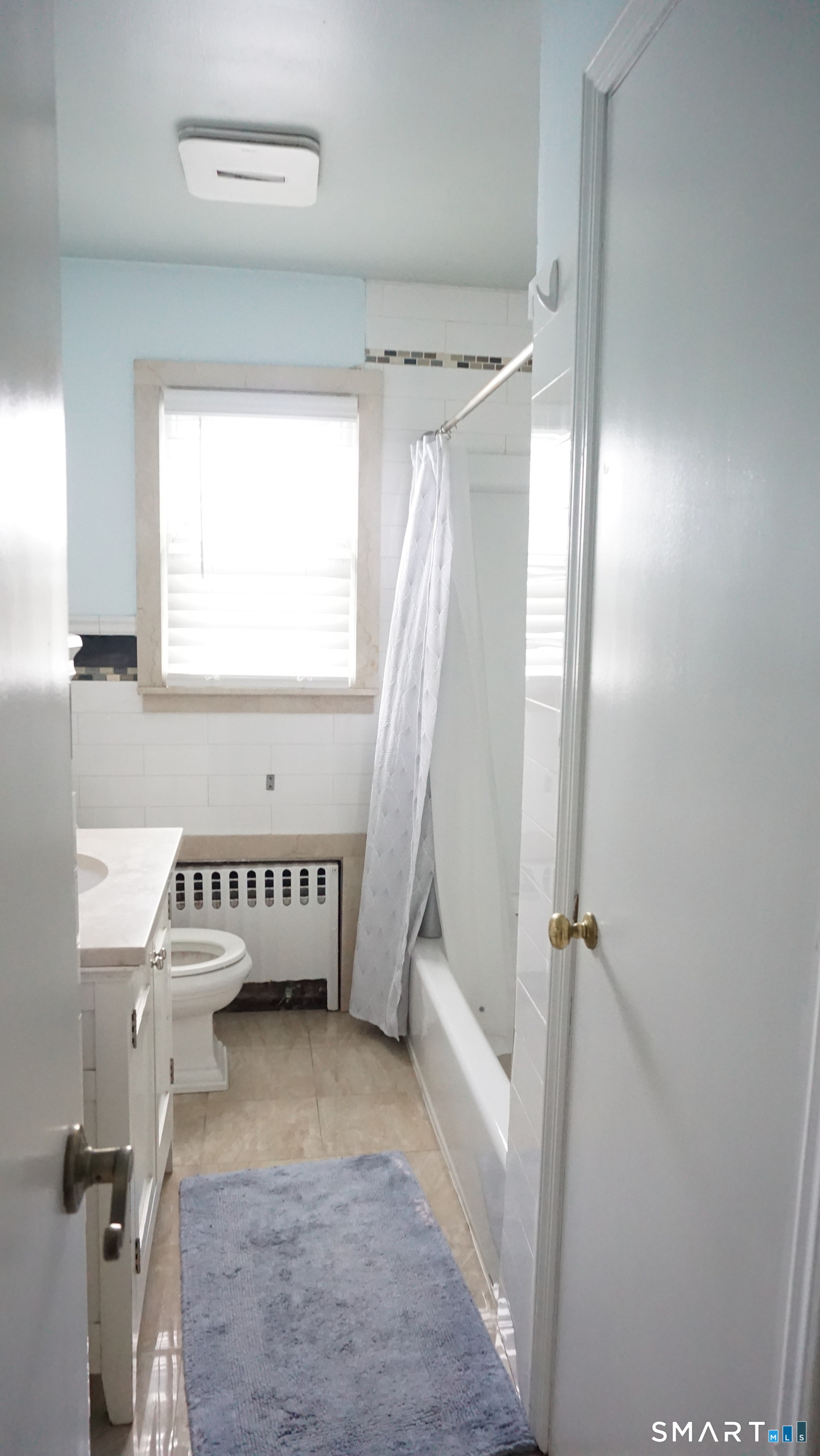 228 Jennings Road Fairfield, CT 06825 - Photo 11 of 22 a view of bathroom with bathtub and window