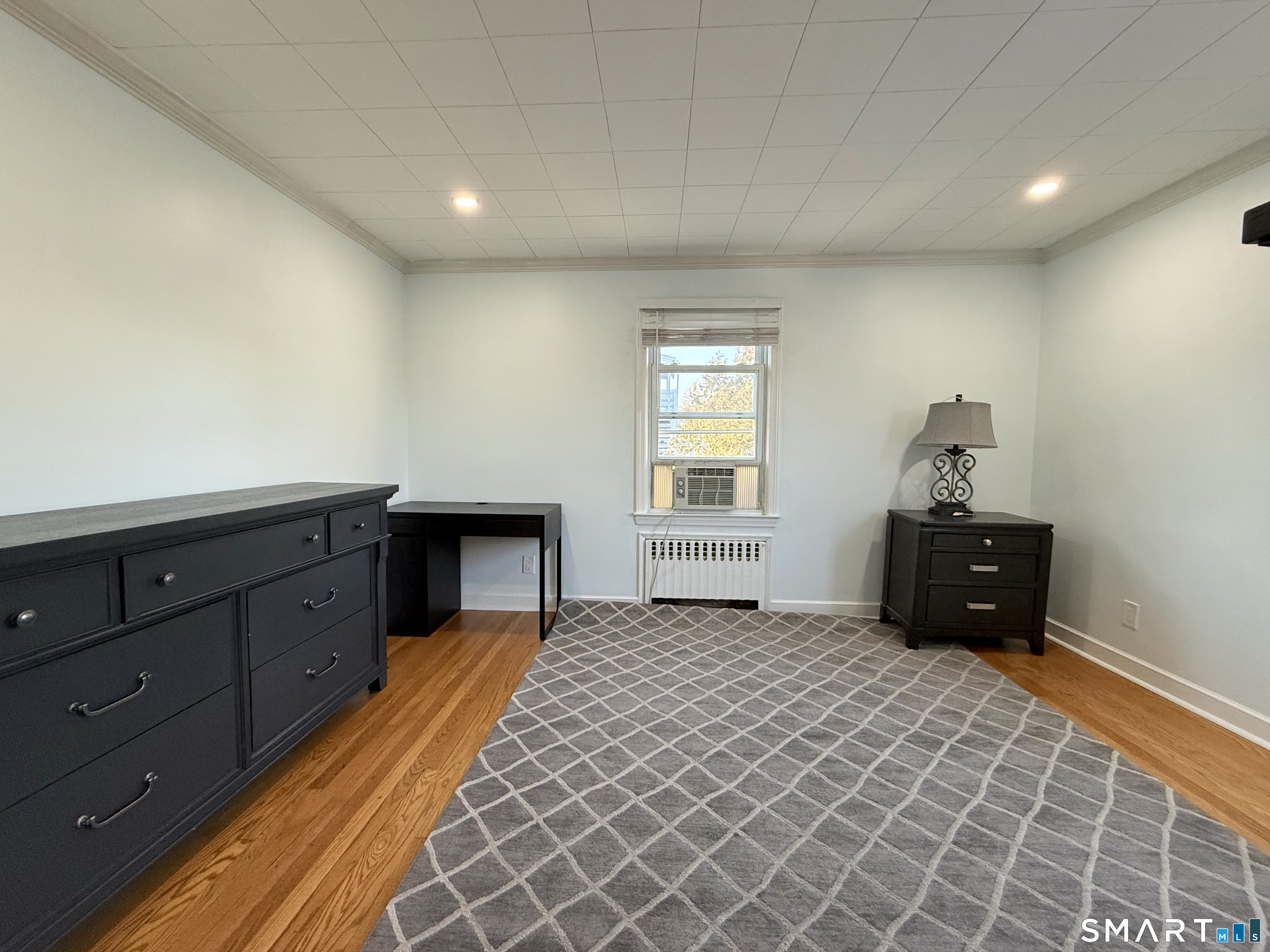 228 Jennings Road Fairfield, CT 06825 - Photo 15 of 22 a bedroom with a bed and a window