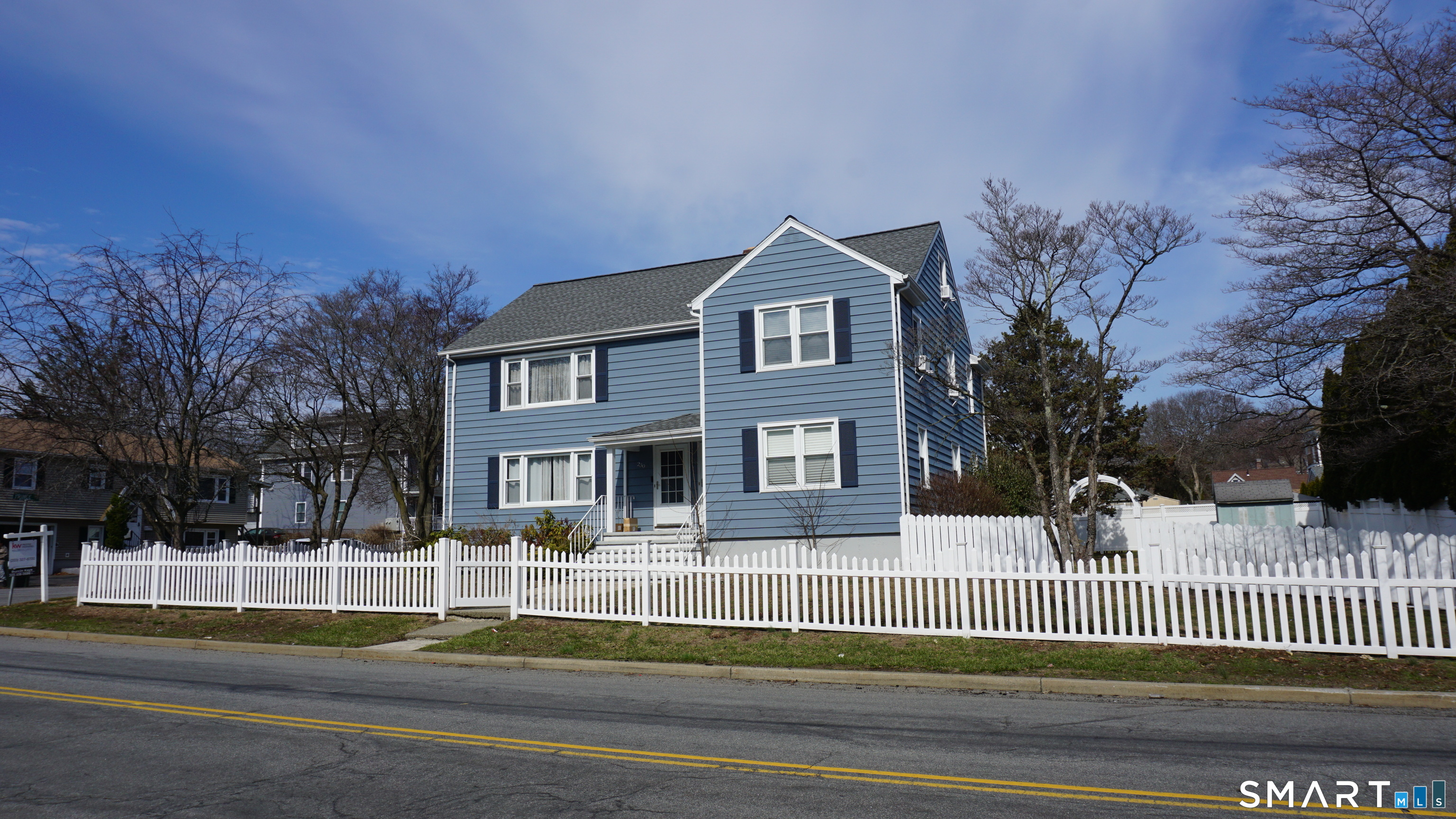 228 Jennings Road Fairfield, CT 06825 - Photo 2 of 22 a front view of a house with a garden and plants