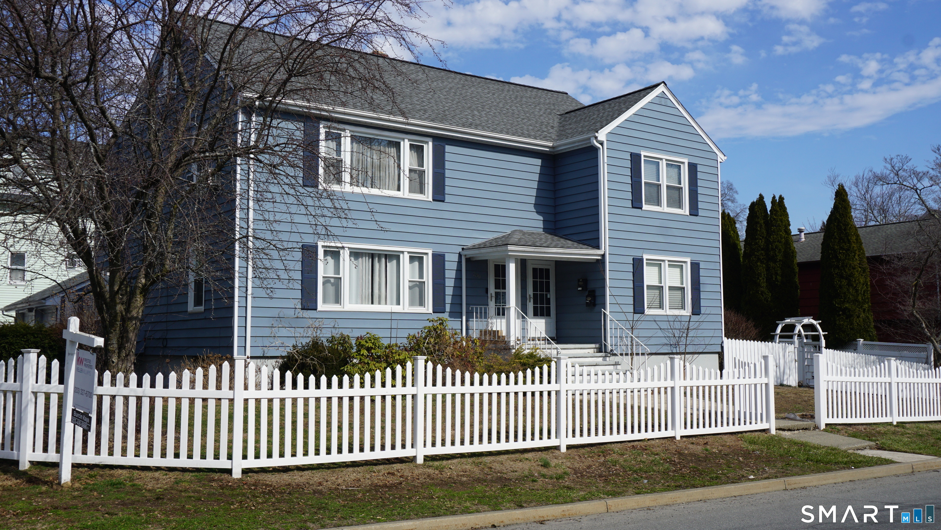 228 Jennings Road Fairfield, CT 06825 - Photo 21 of 22 a front view of a house with a garden