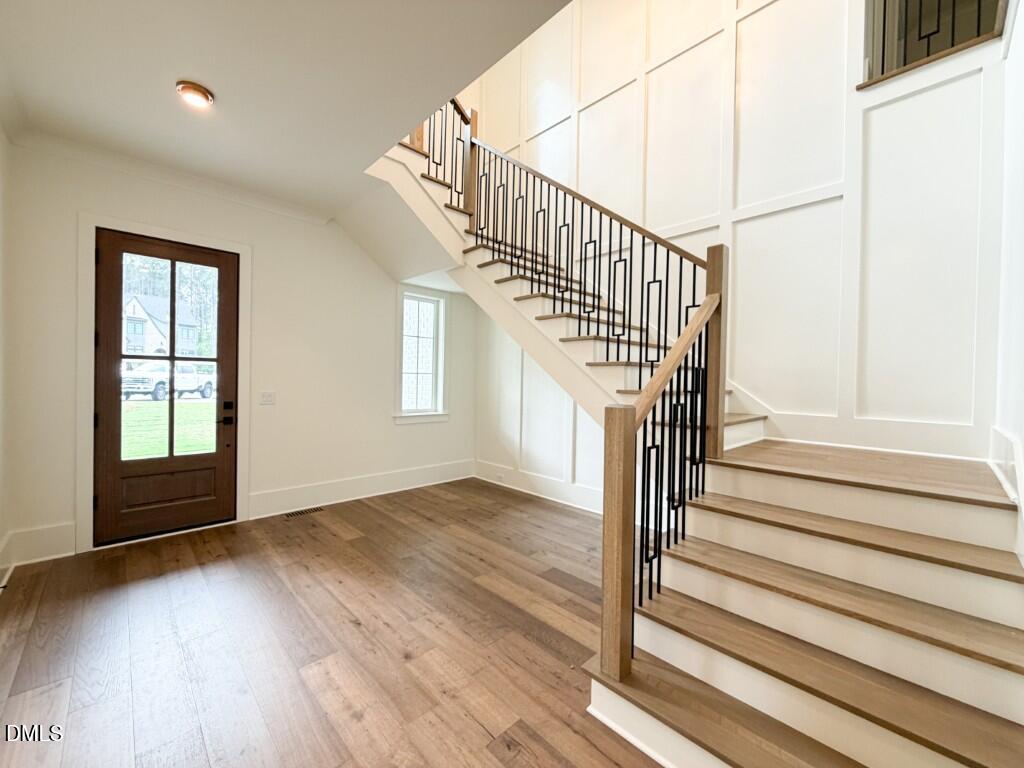 7441 Summer Tanager Trail Raleigh, NC 27614 - Photo 3 of 48 a view of entryway and hall with wooden floor