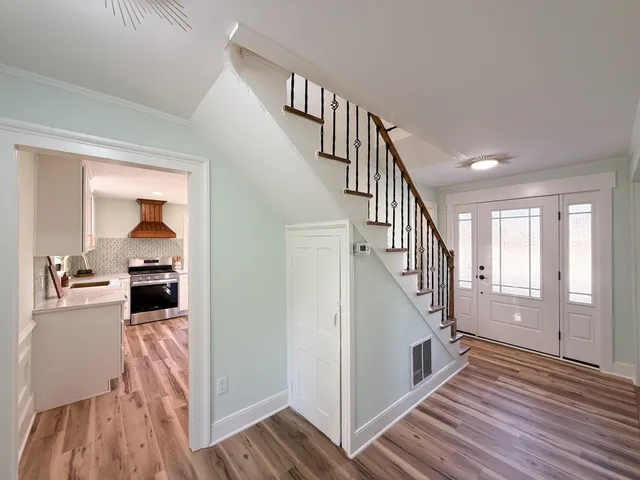 a stove top oven sitting inside of a kitchen