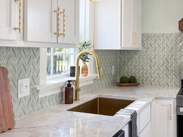a kitchen that has a table and chairs in it