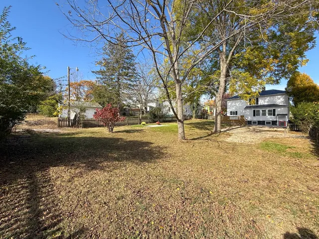 a view of a house with wooden deck