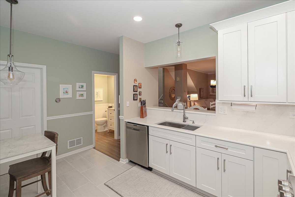 3481 Ravinia Circle Aurora, IL 60504 - Photo 11 of 28 a kitchen with a sink cabinets and appliances