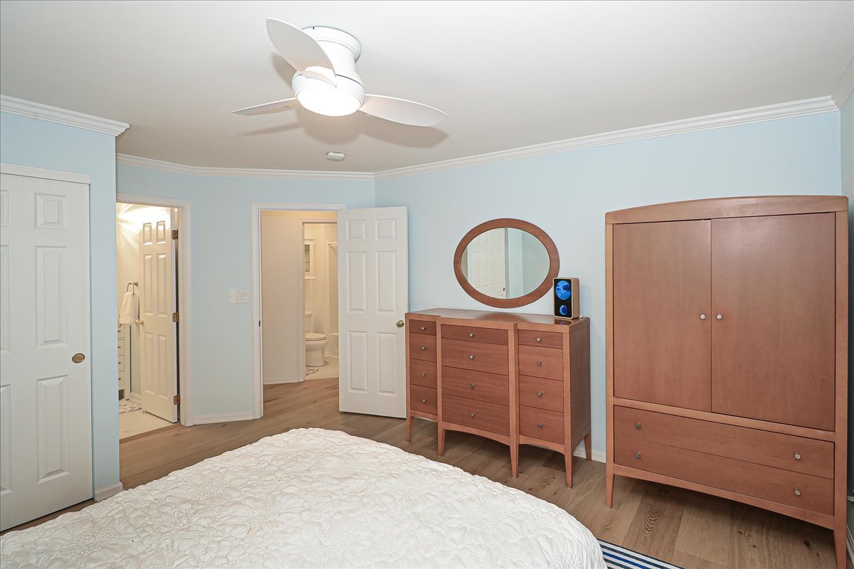 3481 Ravinia Circle Aurora, IL 60504 - Photo 14 of 28 a bedroom with a bed and a chandelier