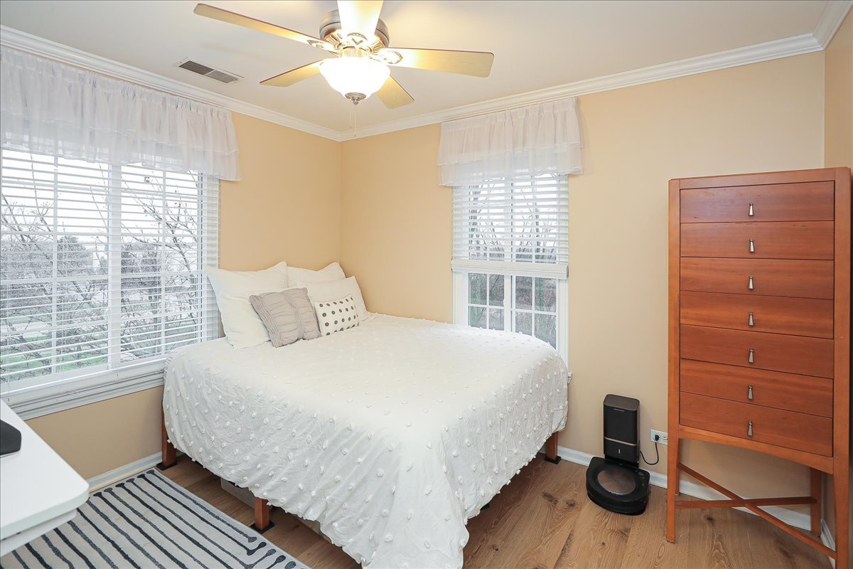 3481 Ravinia Circle Aurora, IL 60504 - Photo 16 of 28 a bedroom with a large bed and a window