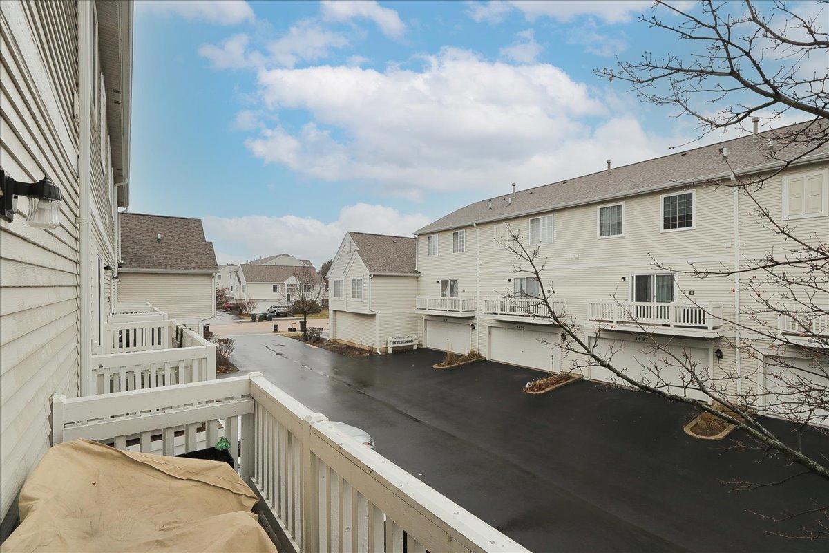 3481 Ravinia Circle Aurora, IL 60504 - Photo 26 of 28 a view of a kitchen with granite countertop a sink and a stove