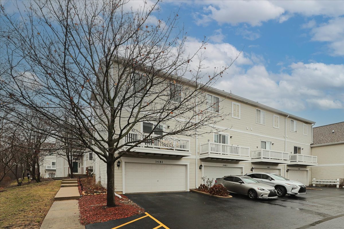 3481 Ravinia Circle Aurora, IL 60504 - Photo 27 of 28 a view of a cars park in front of house