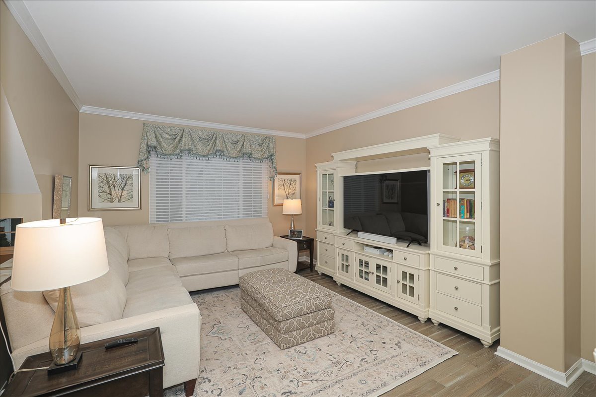 3481 Ravinia Circle Aurora, IL 60504 - Photo 4 of 28 a living room with furniture and a flat screen tv